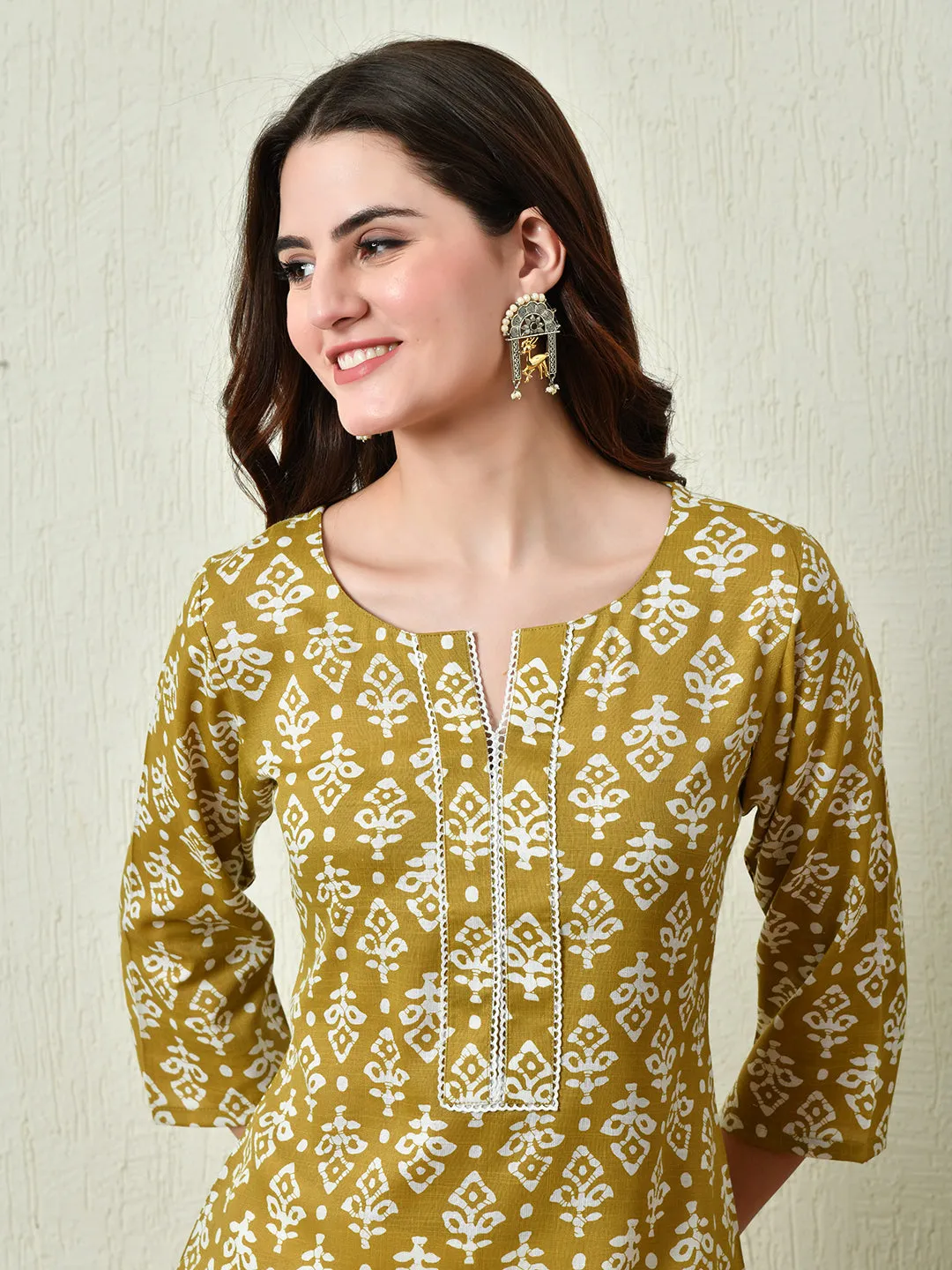 Women Stylish Mustard Cotton Short Kurti With Elegant Print