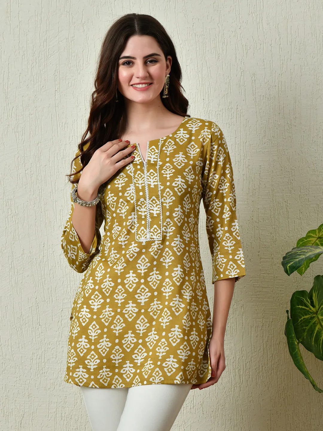 Women Stylish Mustard Cotton Short Kurti With Elegant Print